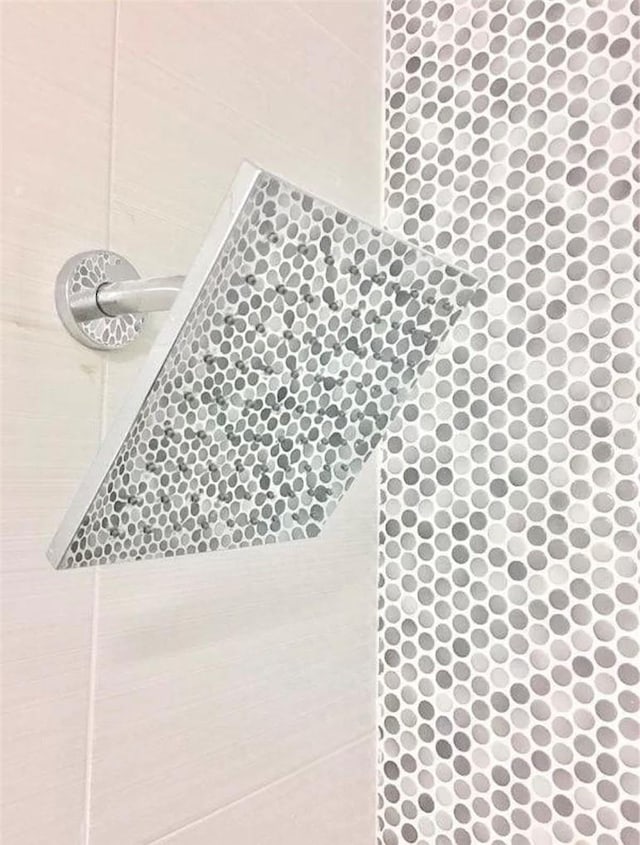 details with a tile shower