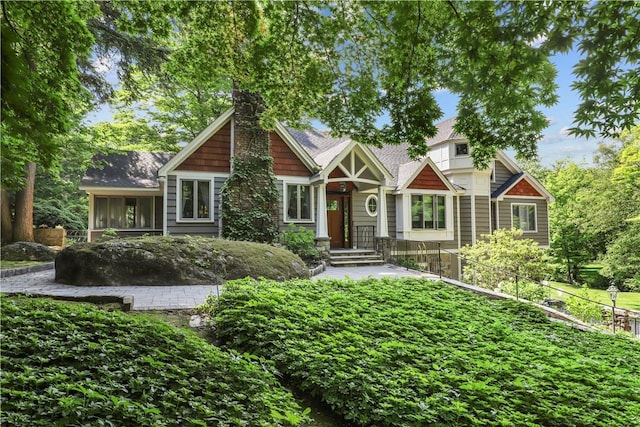 craftsman inspired home featuring a sunroom