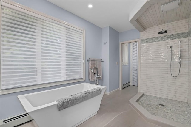 bathroom featuring plus walk in shower and a baseboard radiator