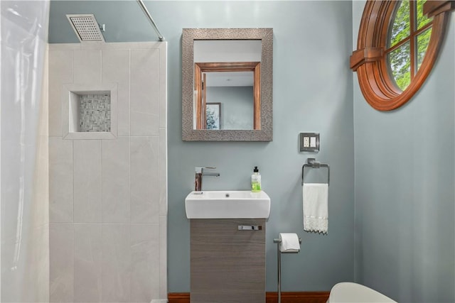 bathroom with vanity, a shower with shower curtain, and toilet