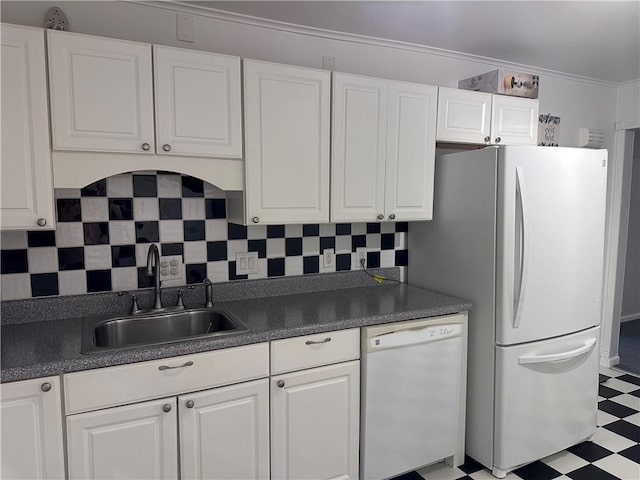 kitchen with white cabinets, white appliances, tasteful backsplash, and sink