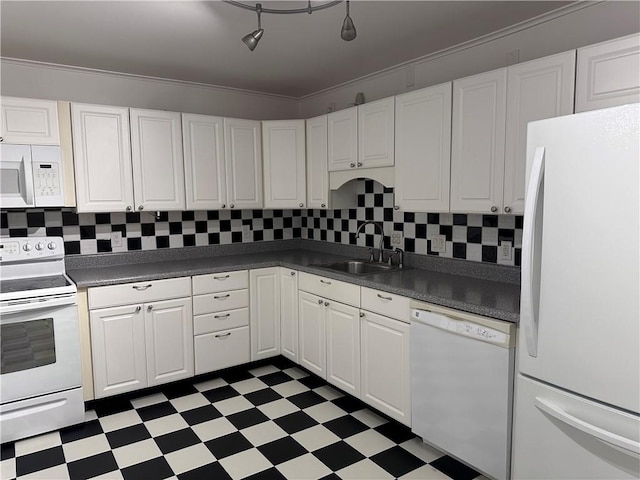 kitchen with white appliances, white cabinetry, crown molding, and sink