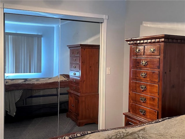 carpeted bedroom with a closet