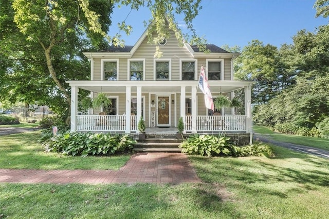 view of front of house with a front lawn and a porch