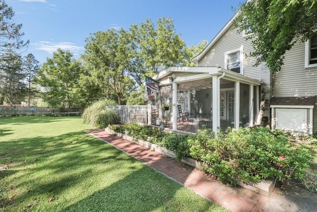 view of yard featuring a sunroom