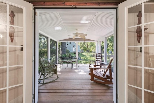 interior space featuring ceiling fan and lofted ceiling