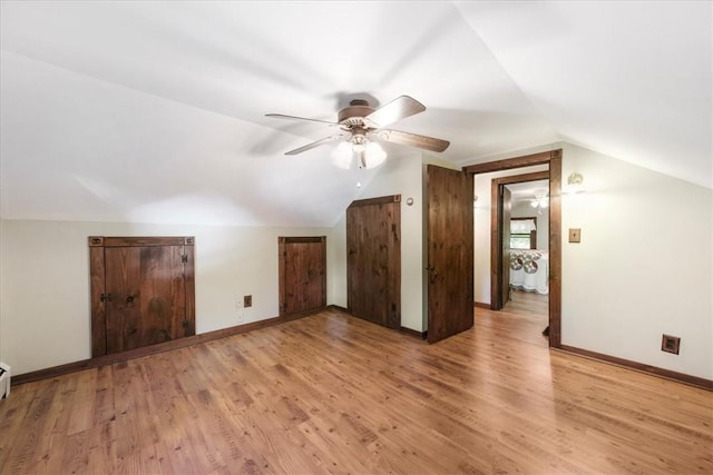 bonus room with light hardwood / wood-style floors, ceiling fan, and lofted ceiling