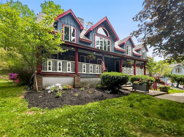 view of front of home with a front lawn and a porch