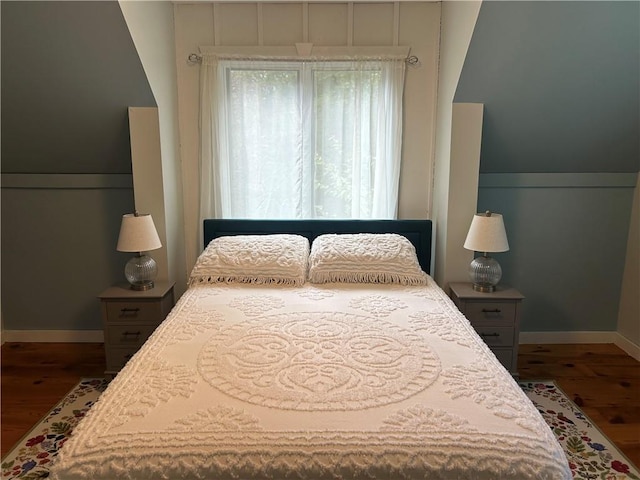 bedroom with hardwood / wood-style floors