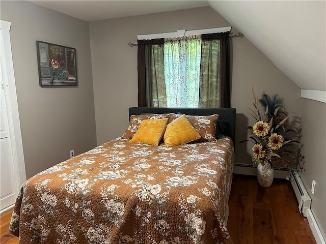 bedroom featuring dark hardwood / wood-style flooring, lofted ceiling, and baseboard heating