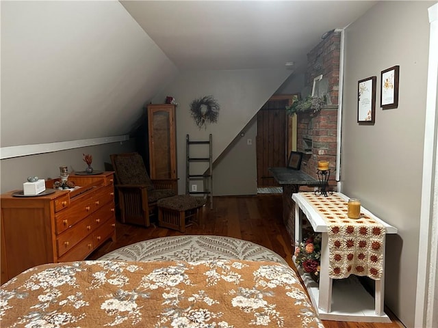 bedroom with dark hardwood / wood-style flooring and vaulted ceiling