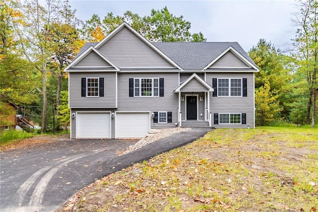 split foyer home featuring a garage