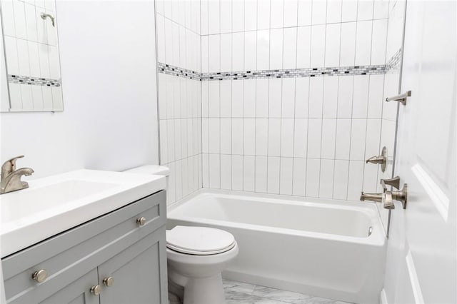 full bathroom featuring vanity, toilet, and tiled shower / bath