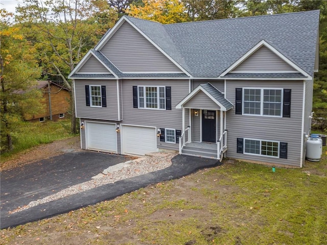 bi-level home featuring a garage