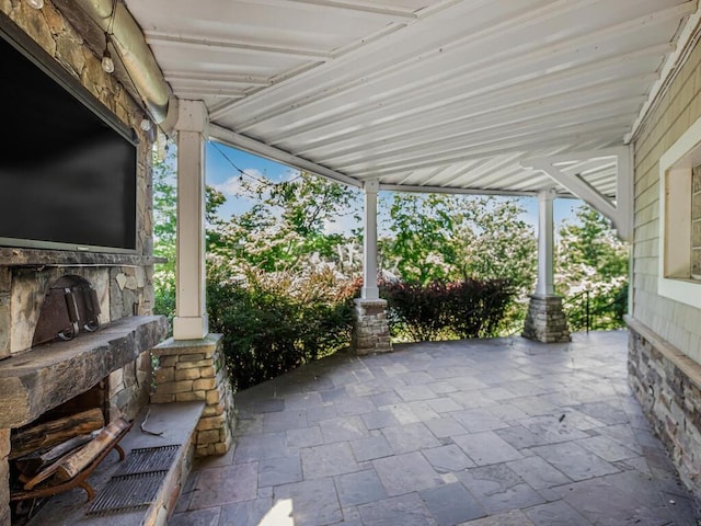 view of patio / terrace featuring exterior fireplace