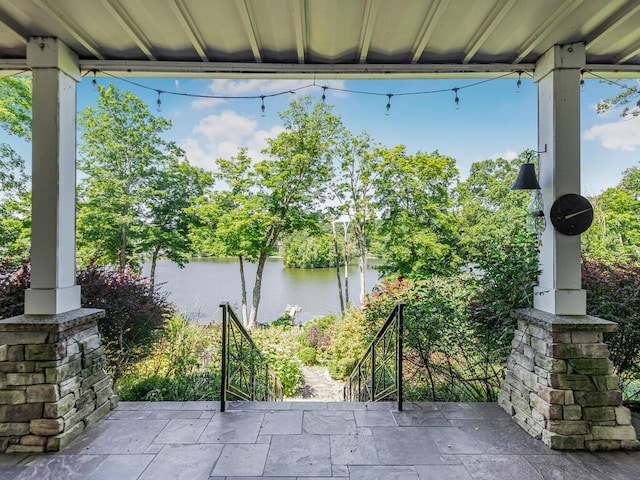 view of patio / terrace with a water view