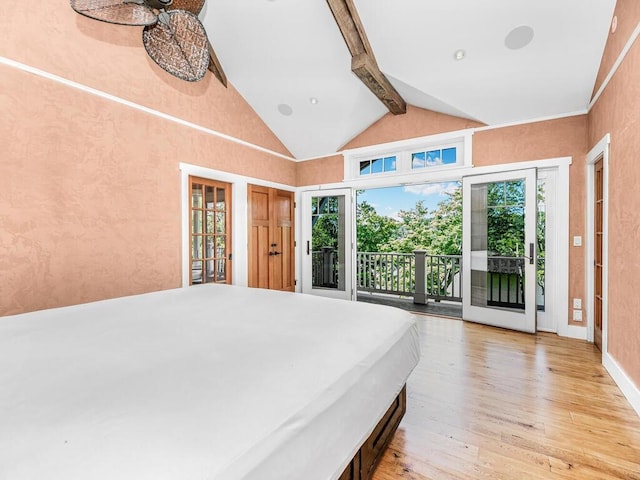 unfurnished bedroom with access to exterior, beam ceiling, high vaulted ceiling, and light hardwood / wood-style flooring