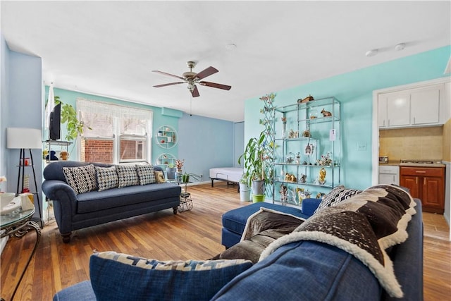 living room with hardwood / wood-style floors and ceiling fan