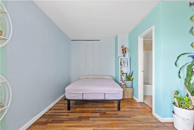 bedroom featuring hardwood / wood-style floors