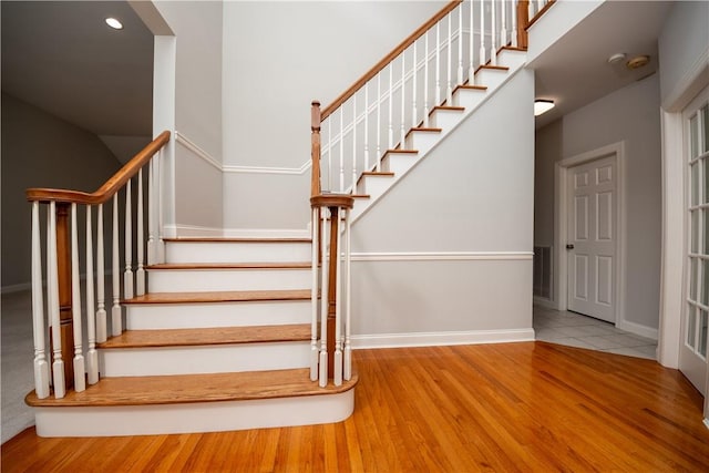 staircase featuring hardwood / wood-style flooring