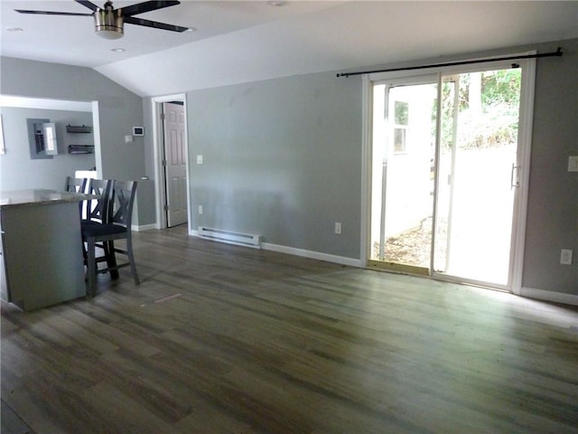 unfurnished dining area with ceiling fan, a baseboard radiator, dark wood-type flooring, and vaulted ceiling