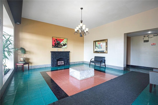 interior space featuring a high end fireplace and a chandelier