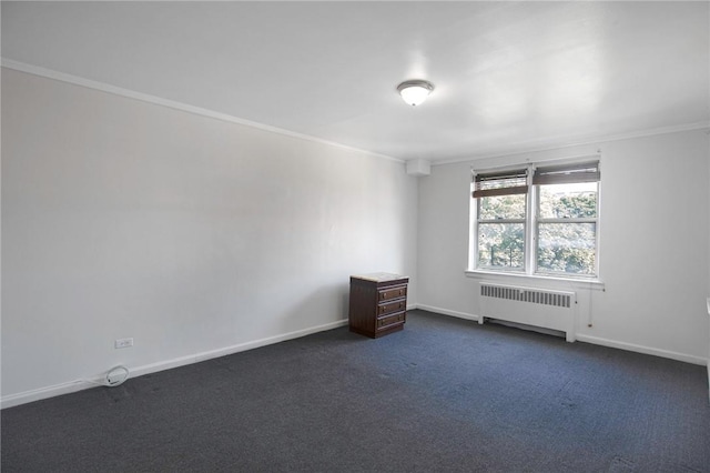 carpeted empty room featuring crown molding and radiator heating unit