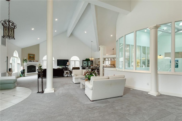 carpeted living room featuring beam ceiling and high vaulted ceiling