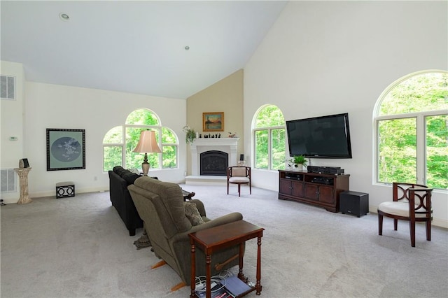 carpeted living room featuring high vaulted ceiling