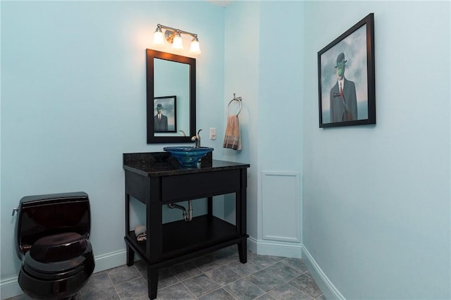 bathroom with tile patterned floors and vanity