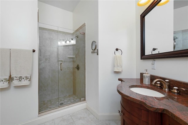 bathroom with tile patterned floors, a shower with door, and vanity