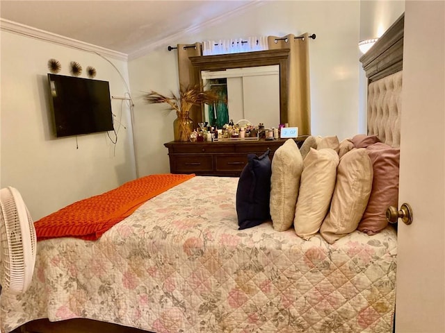 bedroom featuring crown molding