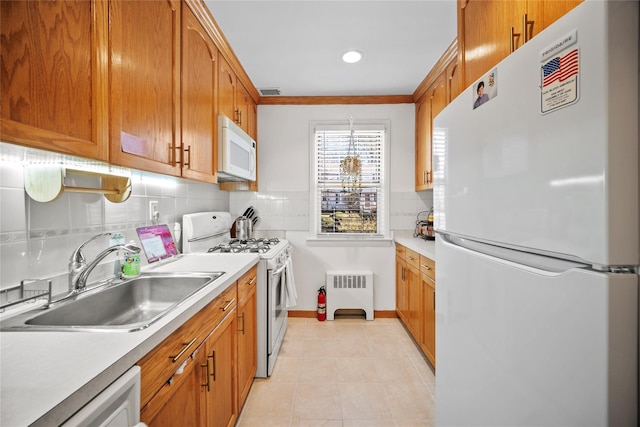 kitchen with tasteful backsplash, white appliances, sink, decorative light fixtures, and light tile patterned flooring