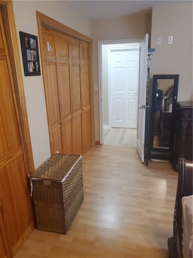 hallway with light wood-type flooring