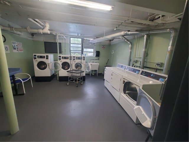 washroom with sink and washer and dryer