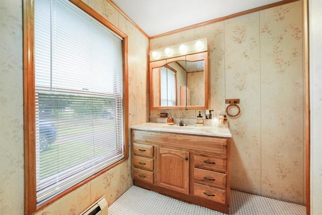 bathroom with vanity and ornamental molding