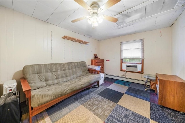 sitting room featuring dark colored carpet, a baseboard radiator, cooling unit, and ceiling fan