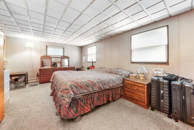 carpeted bedroom with baseboard heating