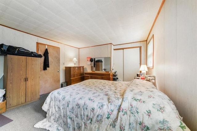 carpeted bedroom with crown molding