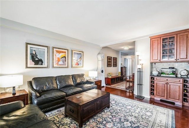 living room with dark hardwood / wood-style flooring