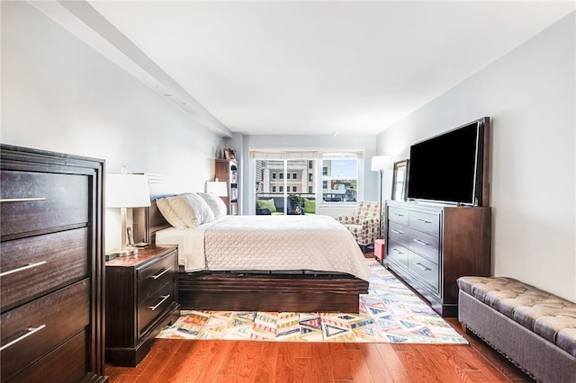 bedroom with wood-type flooring