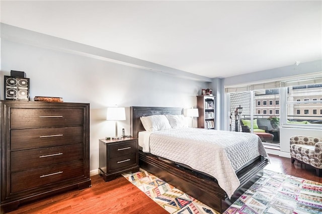 bedroom with wood-type flooring