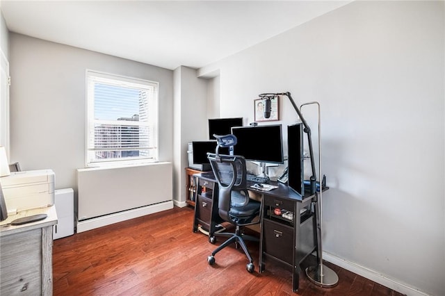 home office with hardwood / wood-style floors