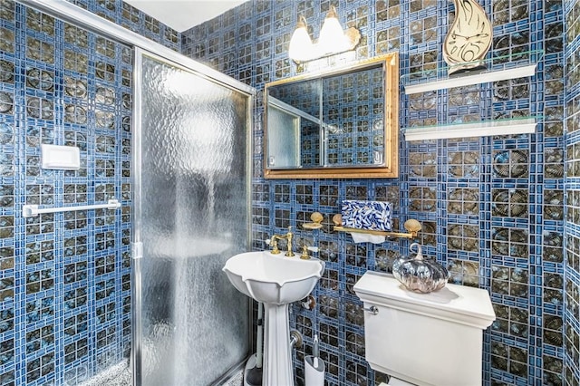 bathroom with toilet, tile walls, and walk in shower