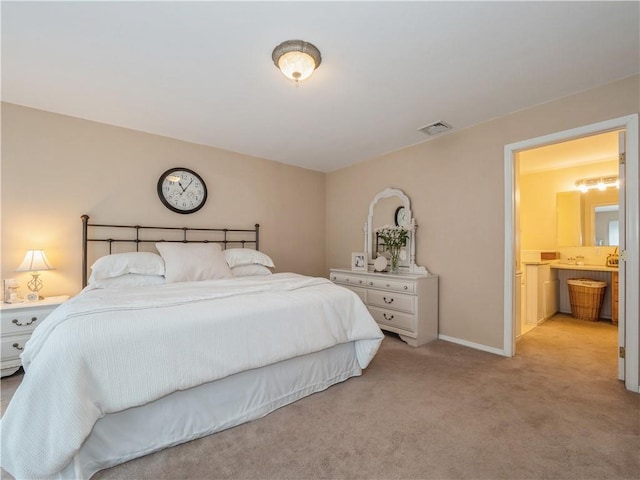 bedroom with light colored carpet, visible vents, and baseboards