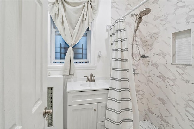 bathroom featuring curtained shower and vanity