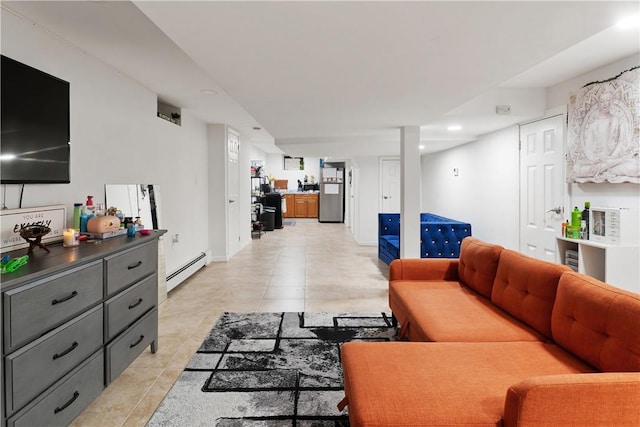 tiled living room featuring baseboard heating