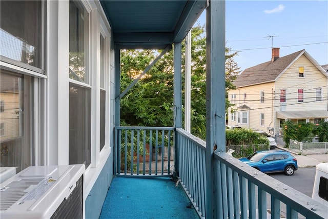 balcony with ac unit and covered porch