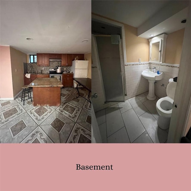 bathroom with tile patterned floors and tile walls