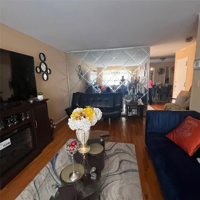 living room featuring dark wood-type flooring